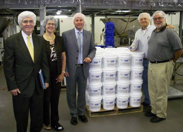 Verticon completes 92,000-square-foot project for cake icing manufacturer From left to right: Rick Struck and Toni Graziano of Orange & Rockland Utilities, Inc.; Kevin O'Reilly, CEO of Satin Fine Foods; Irv Zuckerman of Verticon; Alan Zuckerman of Verticon. Verticon recently completed a 92,000 square-foot project located on Elkay Drive in Chester for Satin's food manufacturing facility for both cake icing and a bakery.