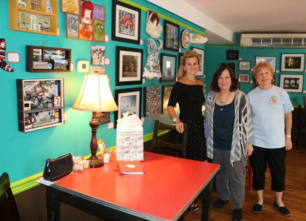 Photography and Mixed Media Art Show at Tuscan Cafe to Benefit Backpack Snack Attack Photo by Roger Gavan From left, Hope Stuart, event organizer and president of H.O.P.E. DAYLEE USA, photographer Wendy Robinson and Backpack Snack Program Director Shirley Puett.