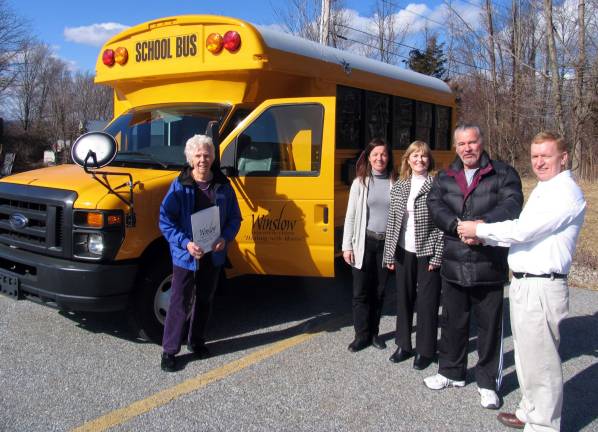 Winslow receives grant for new school bus manufactured in Warwick Photo by Roger Gavan Dan Daniels, president of Warwick's Trans Tech Bus, a division of Transportation Collaborative, Inc., presents the keys of a brand new school bus to John Buckley, vice president of Winslow Therapeutic Center's Board of Directors. The 14-passenger bus is equipped with special features including a handicapped lift. Pictured from left are: Executive Director Emeritus Virginia C. Mazza-Loomis, Executive Director Susan Ferro, Board of Directors Secretary Janne Sommer, Vice President John Buckley and Dan Daniels, president of Warwick's Trans Tech Bus.