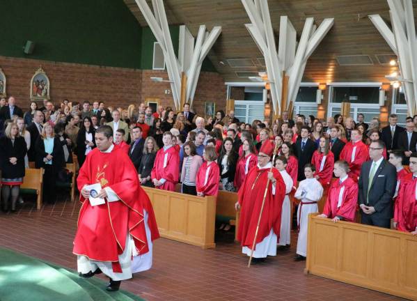 'Confirmation is a sacrament of action' Photos by Roger Gavan On Friday and Saturday, March 16-17, approximately 115 candidates received the Sacrament of Confirmation at the Church of St. Stephen, the First Martyr.