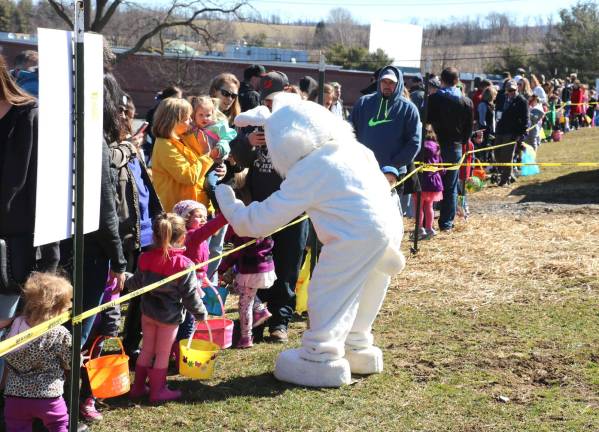 The hunt, part two Photos by Roger Gavan The Easter Bunny was also on hand to greet everyone along the starting line and pose for photos with the children before and following the egg hunt.