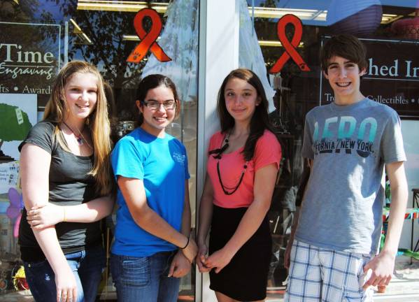 Students paint orange ribbons on Main Street Students paint orange ribbons on Main Street