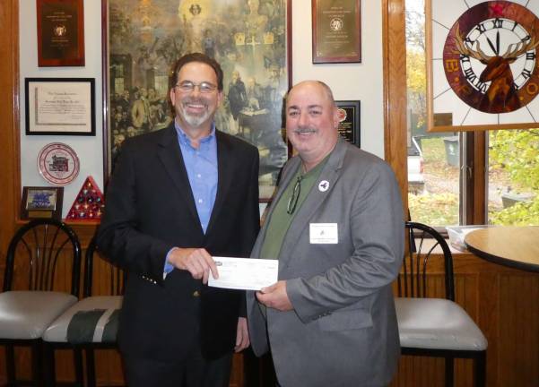 Seely & Durland Insurance and others award GWL Elks Lodge $1,000 grant Garrett Durland, left, and Dennis Murphy, right.