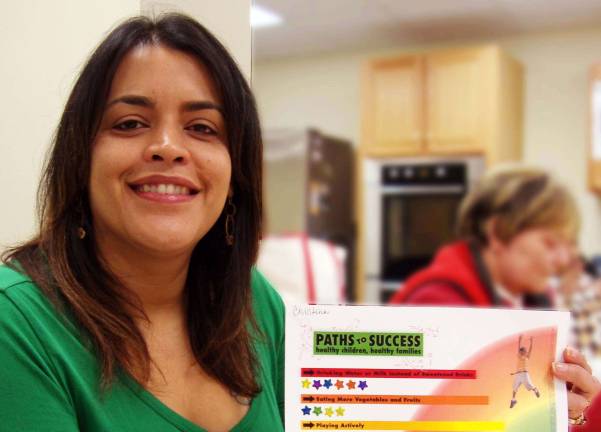 New program promotes healthier eating habits Healthy Children ñ Healthy Families participant Christina Ortega shares her familiesí progress on a ìPaths to Success Chart.î