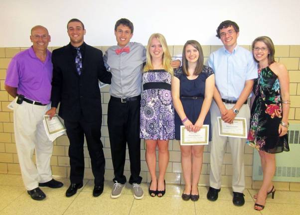 Warwick Valley Teachers Association awards $9,000 in scholarships Pictured from left to right are WVTA member Robert Slutsky, Scholarship recipients John Garcia, Tyler Folino, Deirdre Davis, Kimberly Scopetta and Timothy Beyer, and WVTA member Kelli Sciarra.