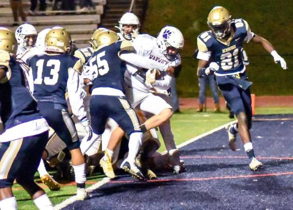 Warwick’s Jake Durie (#44) punches the football into the end zone for Warwick’s second touchdown in the third quarter at Newburgh Free Academy. Photos by Al Konikowski.