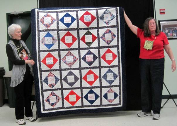 Warwick Valley quilters use their craft to help others Warwick Valley Quilters Guild's Quilt of Valor quilt is held by QOV chair Carol Johnson, right, of Stockholm, N.J., and Corinne Winters of Vernon, N.J., on the left.