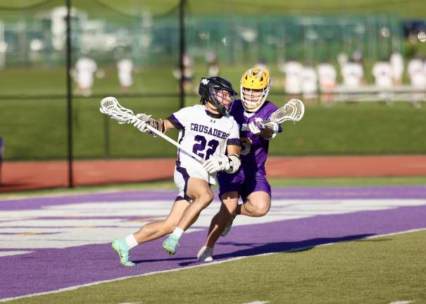Wildcats defeat Crusaders #22, Anthony Severo pushes his way past a Wildcat defender