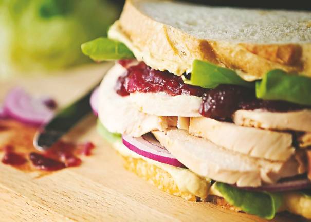Simple Swaps to Make Holiday Meals Better for You Holiday Turkey Sandwich with Hummus and Cranberry.