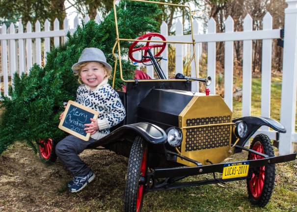 Only 2 days left to vote! Submitted by Keith Rico of Warwick, N.Y. "My 2-year-old son Lucas posing with his Tin Lizzy (1950's era motorized scale model T) and his Christmas Tree!"