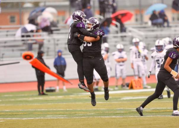 Bryce Coulanges and fellow teammate Jorge Giron (#55) celebrate Coulanges’ 37-yard touchdown reception.