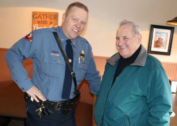 Warwick Police hold seventh Coffee with a Cop at Henry's Deli Resident Patrick Colman chats with Warwick Police Lt. Tom Maslanka. Colman said he was concerned with the poor lighting on Grand Avenue near his home.