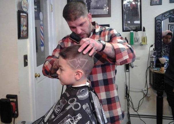 The 'Wildcat Cut' debuts Photo by Sondra Hall Little League Cardinals player, Ethan, (Instructional 8) gets a þÄúWþÄù monogram from barber John Gargano.