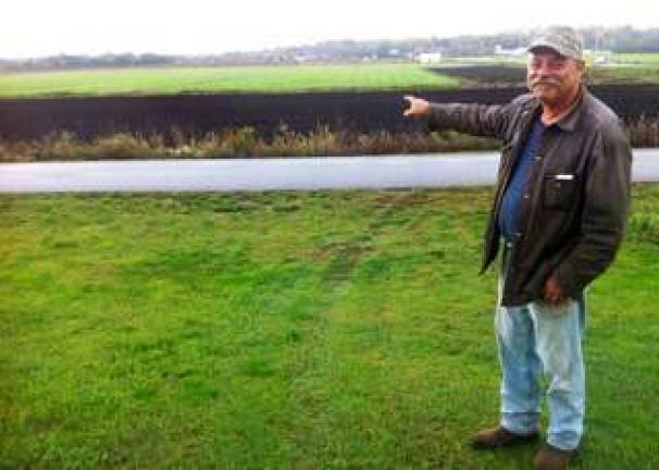 Don't call him a hero Pine Island Chamber will honor man who saved a woman’s life during last year's flood Photo by Cheetah Haysom Paul Kulik of Pine Island points to the Black Dirt field where he saved a woman from drowning after the Hurricane Irene floods last year.