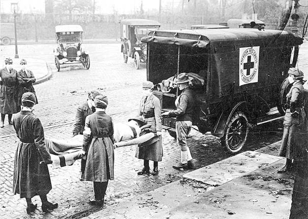 Influenza epidemic in United States. St. Louis, Missouri, Red Cross Motor Corps on duty, October 1918. (National Archives)