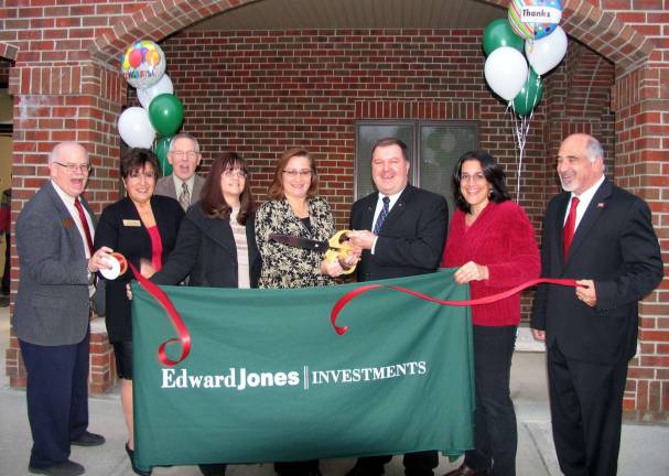 Edward Jones Warwick office celebrates 10th anniversary Photo by Roger Gavan O Dec. 4, Town of Warwick Deputy Supervisor James Gerstner and members of the Warwick Valley Chamber of Commerce Board of Directors joined financial advisor Ed Lynch for a ribbon-cutting ceremony to celebrate the 10th anniversary of his Edward Jones Warwick office. From left: Warwick Valley Chamber of Commerce Secretary Doug Stage, Vice President Sherry Bukovcan and Executive Director Michael Johndrow; Edward Jones Branch Office Assistant Marianne Peterson, Susan and Edward Lynch, on-call Branch Office Assistant Maria Stika and Town of Warwick Deputy Supervisor James Gerstner.