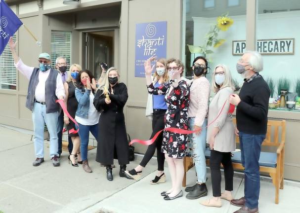On Thursday, May 13, Mayor Michael Newhard (right) and members of the Warwick Valley Chamber of Commerce joined owner Kim Williamson (center) her staff and associates to celebrate the grand opening of Shanti Life with a ribbon cutting. Photo by Roger Gavan.