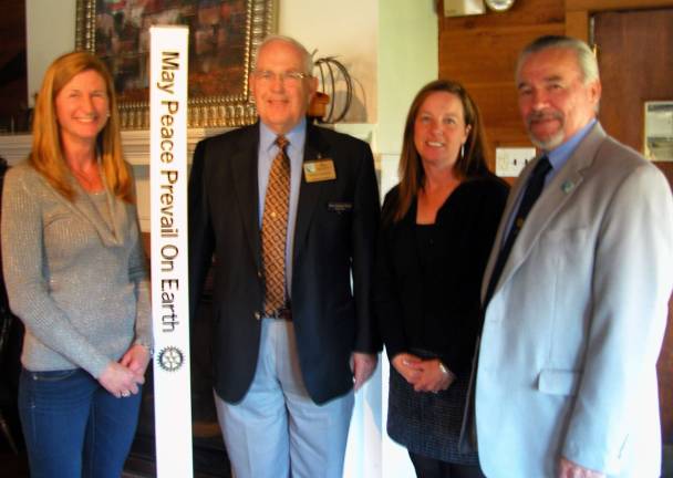 Rotarians donate to Winslow Photo by Stan Martin Warwick Rotary President John Buckley, right, presented a $3,500 donation to Jennifer Caffrey, barn manager, left, and Sue Ferro, Winslow executive director. Assisting in the presentation was Rotary District 7210 Governor Bill Bassett.