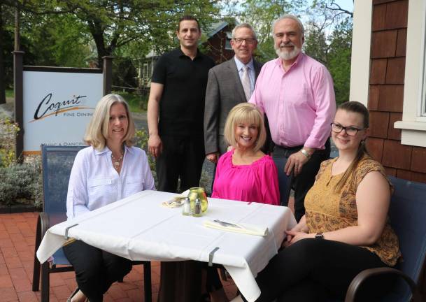 Photo by Roger Gavan Gathered on the patio to plan the Warwick Valley Chamber's May 24 business social at Coquito Restaurant are, from left, Chamber Secretary Kim Starks, Coquito owner Valentino Berisha, Chamber Executive Director Michael Johndrow, Event Planner Janine Dethmers, Chamber President John Redman and Chamber Office Assistant Bea Arner.
