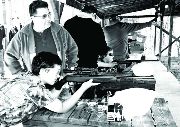 Young sports men and women Photo by Ed Bailey Luke Lopilato, 9, of Greenwood Lake shoots a B-B gun during ìYouth Dayî last Sunday at the Monroe Chester Sportsman Club.