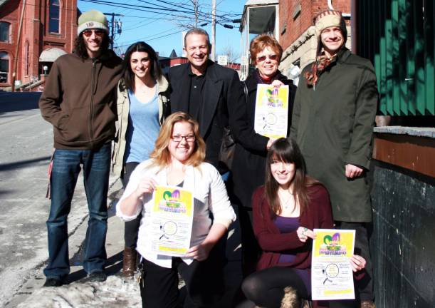 Mardi Gras comes to Warwick Composer/recording artist Clarissa Cupero with singer/guitarist John Desibia, pictured here, and a committee of eight have organized the first Mardi Gras event in Warwick, a charitable event for Back Pack Snack Attack. Rear from left: Eric Callari; Clarissa Cupero; John Desibia; Shirley Puett, executive director of Backpack Snack Attack; and Will Orosz. Front from left: Committee Chair Allison Fox and Gayle Donnelly.
