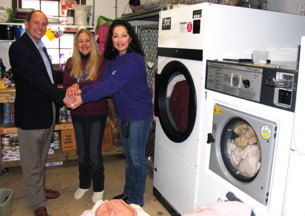 Commercial washer and dryer donated to animal shelter Photo by Roger Gavan From left, Tom Jeppestol, Hercules senior sales associate, Lee Peterson, corresponding secretary for the Warwick Valley Humane Society, and Suzyn Barron, its president.