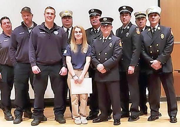 Members of the Warwick Fire Department attend the Orange County Firefighters graduation at the O.C. 911 Center in Goshen last week with to graduate firefighter Kaitlyn Wendel from the Excelsior Hose Company #1, daughter of Past Captain Art Wendel.