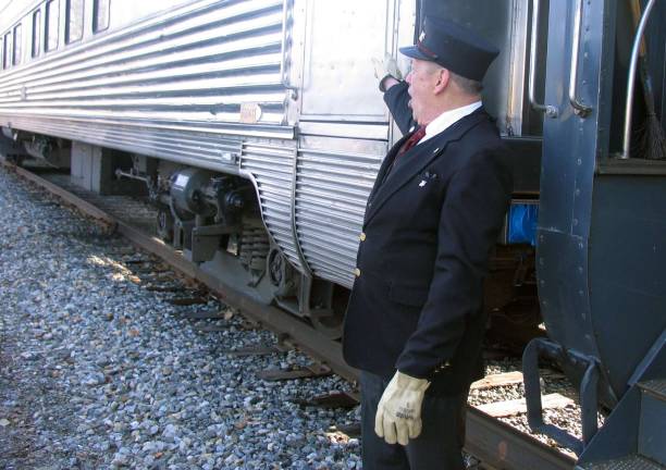 'Operation Toy Train' departs Warwick to deliver toys to needy families Photos by Roger Gavan "All aboard!" Conductor Walt Kierzkowski prepares for departure.