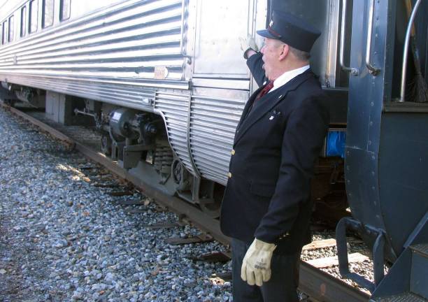 Photos by Roger Gavan &quot;All aboard!&quot; Conductor Walt Kierzkowski prepares for departure.