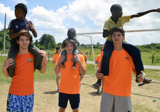Bringing help and hope Playing with the children: From left, Andrew Juliano, James Juliano and Tommy Garneau.