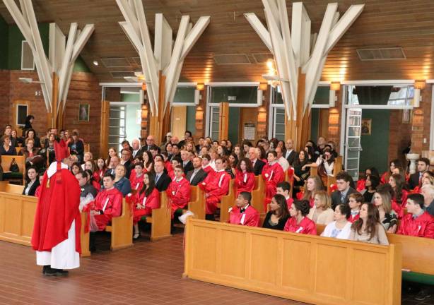 Bishop administers Sacrament of Confirmation at St. Stephen's Before administering the Sacrament, Bishop Lagonegro showed the candidates a photograph of a crowd that included his own aunt and uncle who were present in October 1917 for the "Miracle of the Sun," during the last apparition of the Virgin Mary in Fatima, Portugal.