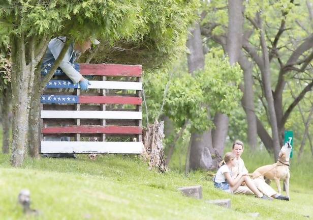 Families gathered on their front lawns waiting for the Memorial Day drive by parade in Pine Island on Monday, May 25. Here’s a family on Amity Road. Photo by Robert G. Breese.