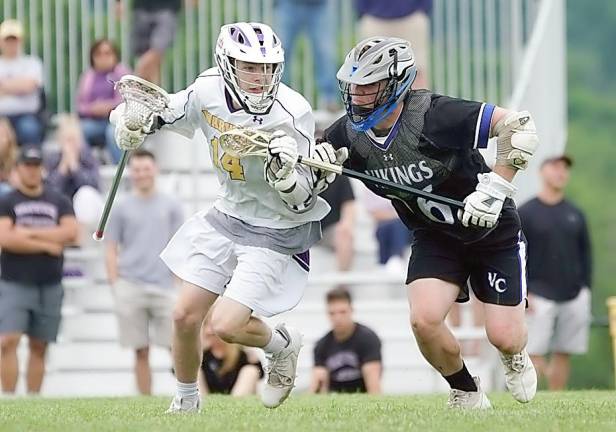 Daniel Colavito runs the ball downfield against a Viking defender.