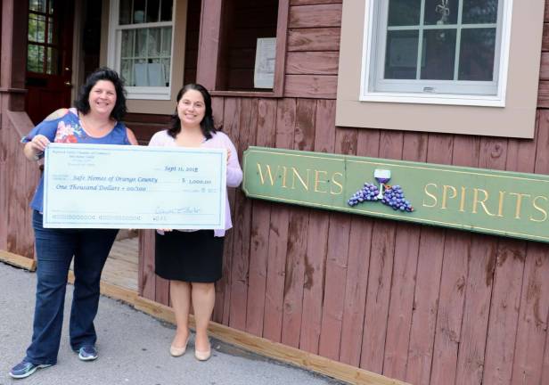 Merchant Guild presents check to Safe Homes Merchant Guild presents check to Safe Homes