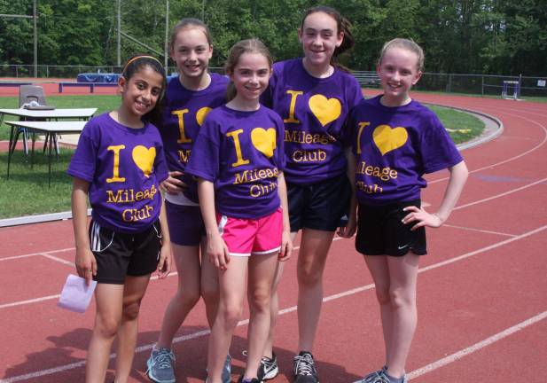1,308 laps, 327 miles, 66 Middle School runners A handful of the Middle School Mileage Club wearing the T-shirts they earned by completely various benchmarks.