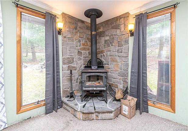 House on country road perched near village and outdoor recreation