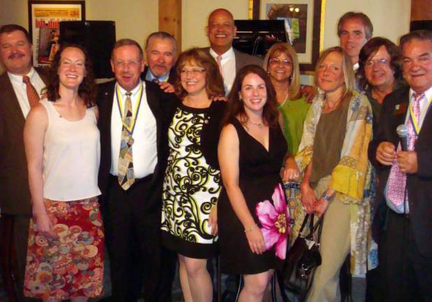 Neil Sinclair heads Warwick Rotary Club Rotary Assistant Governor Stan Martin, right, installs Warwick Rotary President Neil Sinclair and his officers and directors. Shown, left to right, are Edward Lynch, Katie Hansen, Neil Sinclair, John Buckley, Lisette Cuba, Wayne Patterson, Susan Ronga, Mary McClurg, Suzie Miller, Leo R. Kaytes, Frank Truatt and Stan Martin.