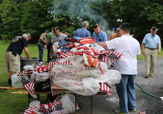 Warwick's American Legion Post 214 conducts flag disposal ceremony Members of American Legion Post 214 prepare to burn approximately 2,500 Flags, the most responsible way to destroy worn, tattered or otherwise damaged American Flags .