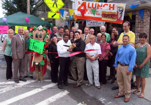 New Subway Restaurant celebrates grand opening Photo by Roger Gavan On July 10, local elected officials and board members of both the Warwick Valley and Village of Florida chambers joined co-owners Harold Knebel and Asad Riaz and their staff to celebrate the grand opening of their new Subway Restaurant at 26 N. Main St. in the Village of Florida. Pictured here are Riaz and Knebel cutting the ribbon held by Town of Warwick Deputy Supervisor James Gerstner (left) and Warwick Valley Chamber of Commerce President Paul Rafanello (right).