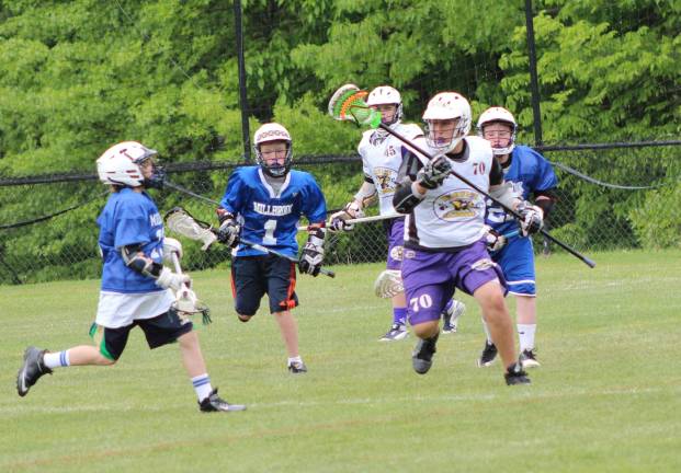 Nothing LAX-adaisical about Warwick Youth Lacrosse Photo by Marie Janiak-Hranitz Jason Hranitz takes the ball out.