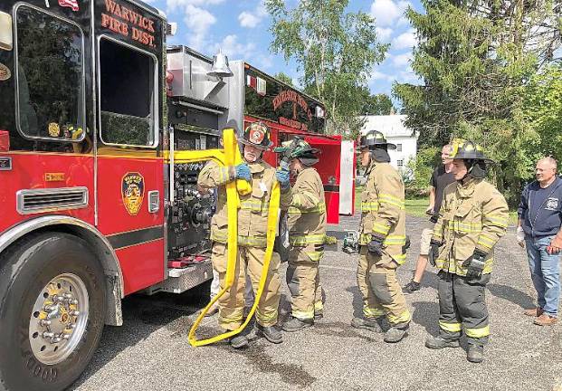 Warwick Fire Department weekly activity report Sept. 1-7 Past Chief Brasier Jason instructs probationary firefighters at WFD new members class on stretching hose to a fire.