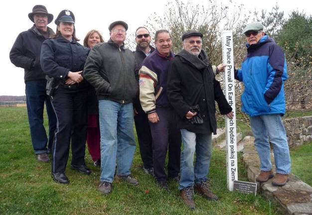 Peace Pole dedicated at Sanfordville Elementary Photos by Louise Hutchinson Helping dedicate a “Peace Pole” in the Peace Garden at Sanfordville Elementary School to honor Warwick educators, military veterans and first responders are, left to right: Tom Brennan, American Legion Post 214 third vice commander; Katie Oresto, Elementary School Resource Officer; Johnna Maraia, Sanfordville Elementary Principal; Dr. Edwin Wiley, Warwick Valley Rotary Club President; Dr. David Leach, Superintendent of Schools; Rotarian Stan Martin, vice commander of Warwick American Legion Post 214; Rotarian John Buckley, retired Warwick Valley High School principal; and David Eaton, Board of Education member.