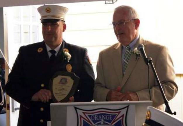 Chad Quackenbush named Fire Prevention Educator of the Year Photo by Heather Pillsworth Chad Quackenbush of Excelsior Hose Co. No. 1 of the Warwick Fire Department, was named the 2013 Fire Prevention Educator of the Year Recipient; he accepts the award from Dr. William Bassett, chairman of the Education Advisory Committee of the Orange County Firefighters Museum.