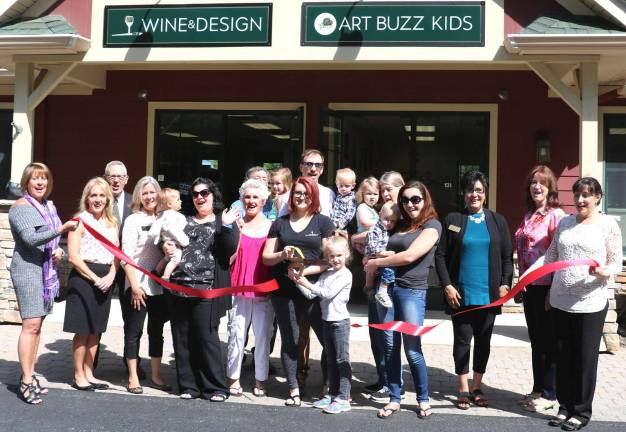 Wine and Design celebrates new management and remodeling of studios Photo by Roger Gavan On Friday, June 9, members of the Warwick Valley Chamber of Commerce joined Wine and Design new owner Chelsea Lade (center), along with members of her family and friends to celebrate the new ownership and renovation of Wine and Design with a ribbon-cutting.