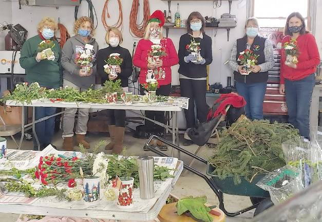 The Warwick Valley Gardeners Club putting together the flower arrangements. Pictured from left to right are: Ellen Nye, Ann Green, Kathryn Ives, Mary Pohlman, Mary Berrigan, Janice Ashe and Laurie Unick.