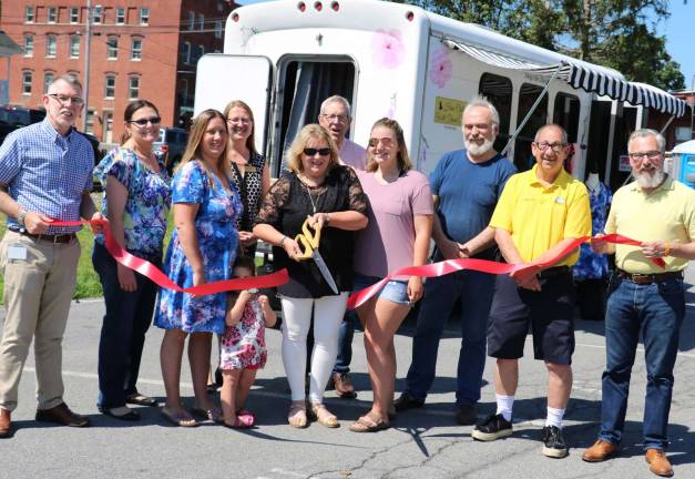 Have Clothes Will Travel celebrates first anniversary Photo by Roger Gavan Warwick Supervisor Michael Sweeton (left), Mayor Michael Newhard (right) and members of the Warwick Valley Chamber of Commerce, joined owner Denise Lisch (center) along with her friends and family to celebrate the first anniversary of the Have Clothes Will Travel Mobile Boutique on June 29.
