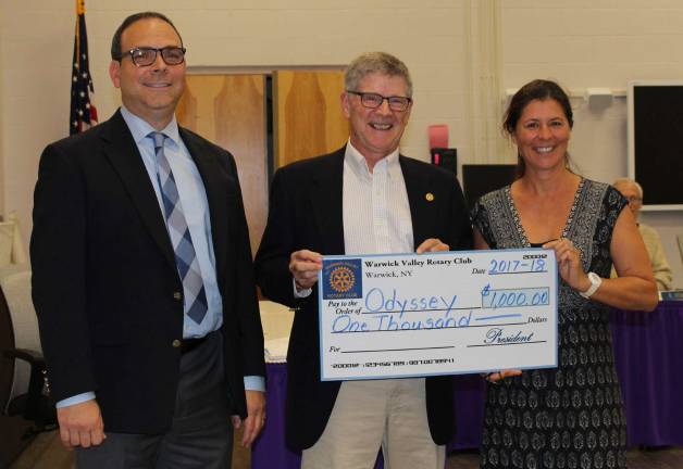 WVSD board considers capital projects Photo by Louise HutchisonWVSD Superintendent Dr. David Leach looks on as Board of Education member and current Rotary Club President David Eaton presents a $1,000 check to Donna Denny, district teacher and OM Advisor, in support of the WVSD Odyssey of the Mind program. "The Warwick Rotary Club is proud to support such a fine program as Odyssey of the Mind," Eaton said. Board of Education President Lynn Lillian also thanked Denny for her support, dedication and leadership of this valuable program.