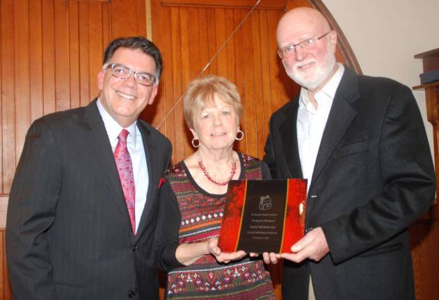 Rev. Michael Otte receives Backpack Snack Attack 'Champion' award Photos by Ed Bailey Pictured from left to right are Event Coordinator Joseph Sclafani, Shirley Puett, the director Backpack Snack Attack, and the Rev. Michael Otte, former pastor of the Warwick Reformed Church.
