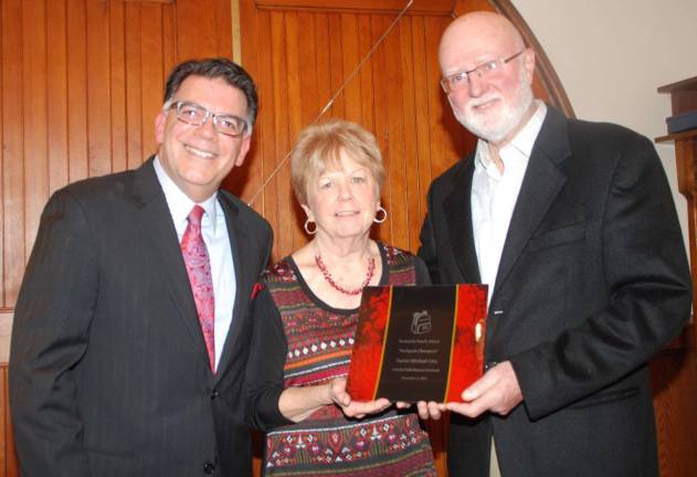 Photos by Ed Bailey Pictured from left to right are Event Coordinator Joseph Sclafani, Shirley Puett, the director Backpack Snack Attack, and the Rev. Michael Otte, former pastor of the Warwick Reformed Church.