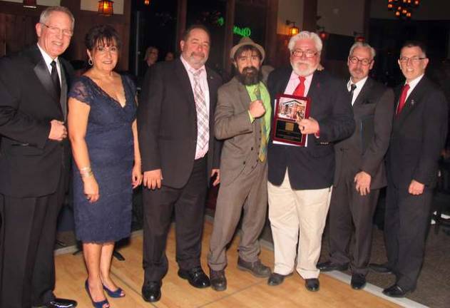 Seventy-five years in the making Thomas Roberts and Joseph Justin, owners of Ye Olde Warwick Book Shoppe in Warwick, received the annual award for Best Building Renovation. From left, Executive Director Michael Johndrow, Chamber President Sherry Bukovcan, renovation contractor Paul Hipsman, owners Joseph Justin and Thomas Roberts, Mayor Michael Newhard and Town of Warwick Supervisor Michael Sweeton.